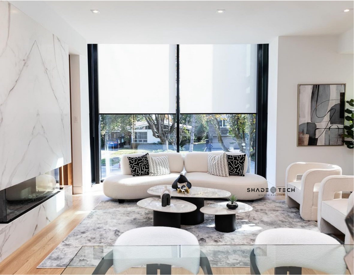 Motorized roller shades in a living room