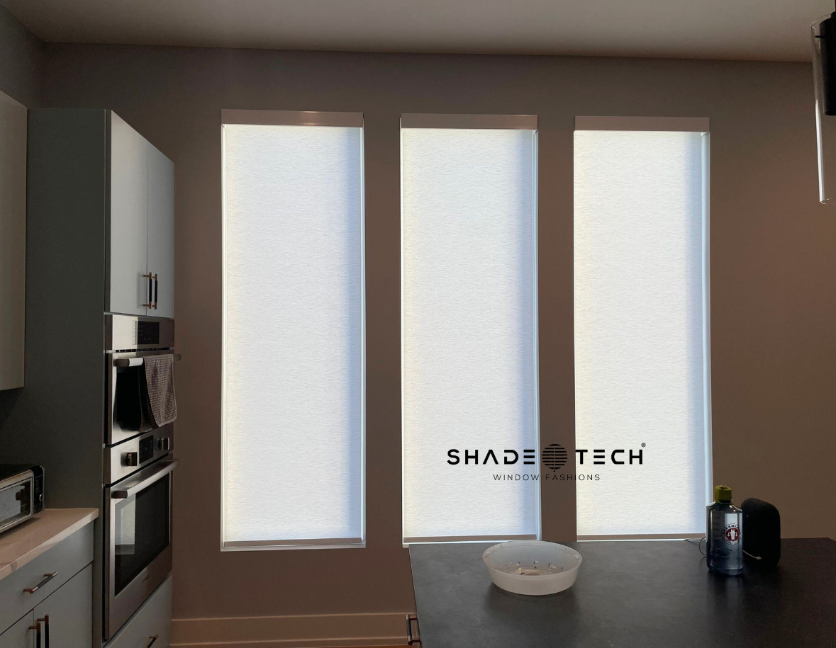 Light-filtering roller shades on tall kitchen windows