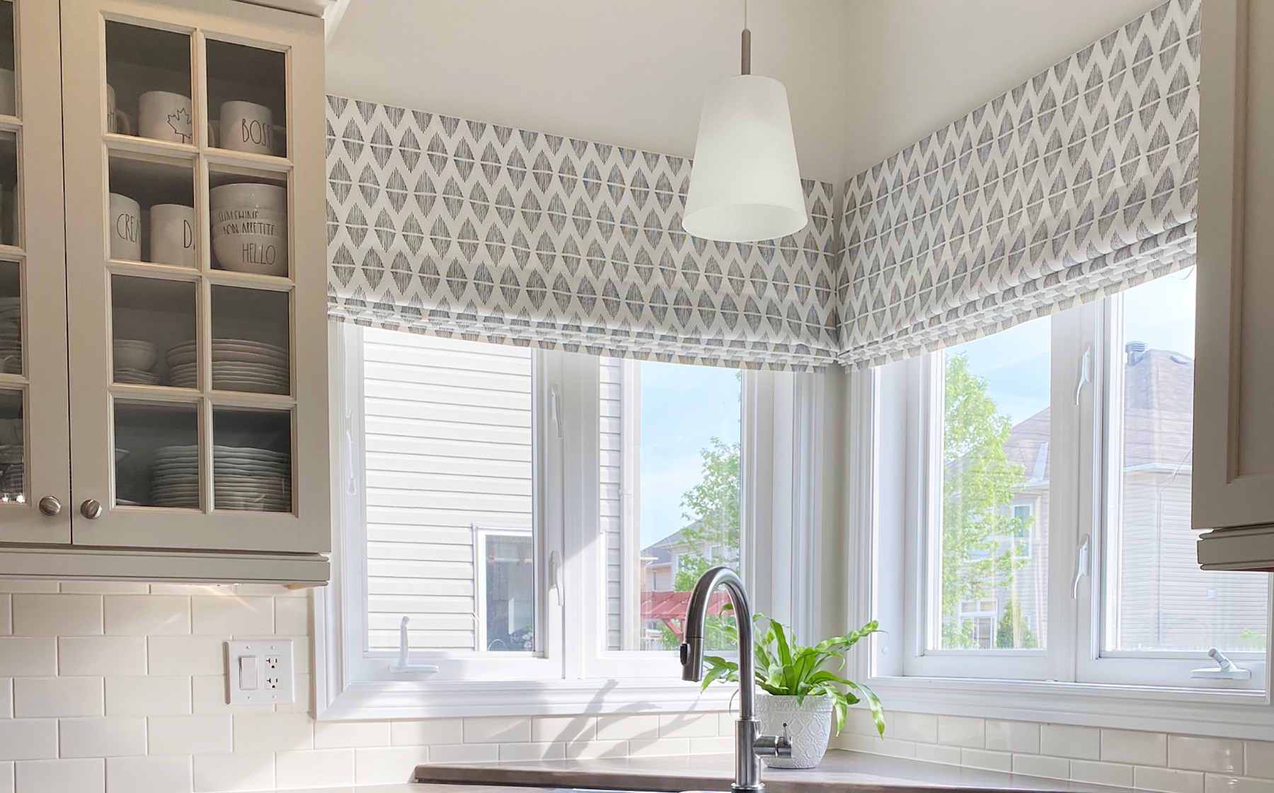 Open Roman lattice shades in a bright living room