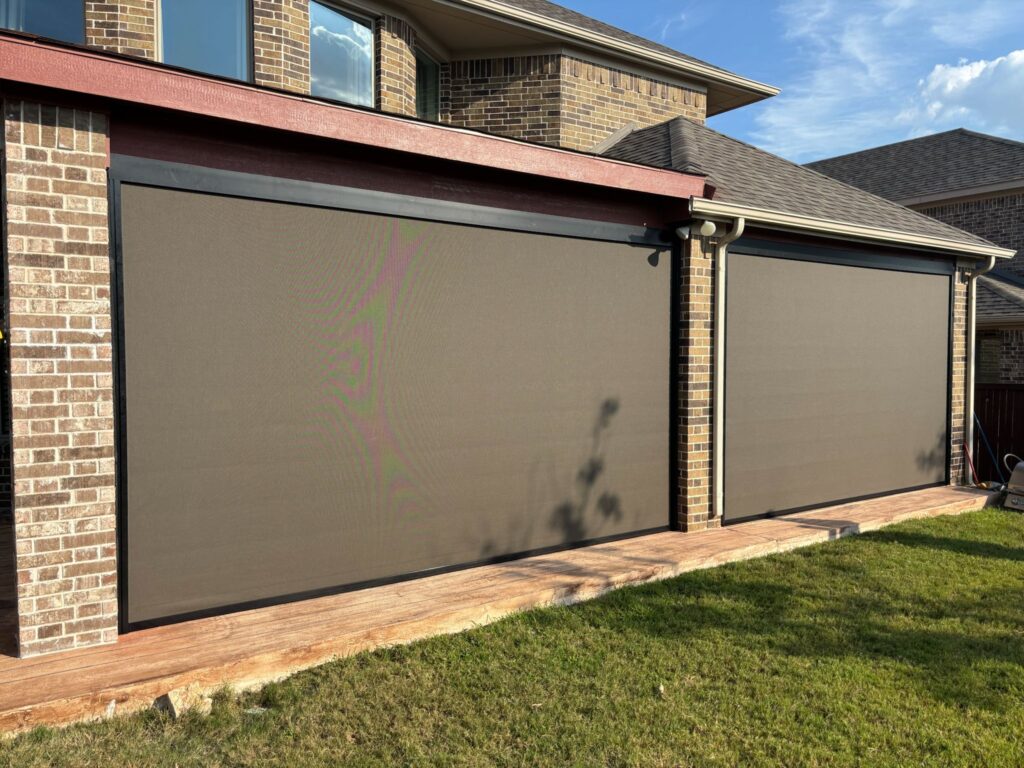 Bronze privacy fabric zip-track screens fully lowered